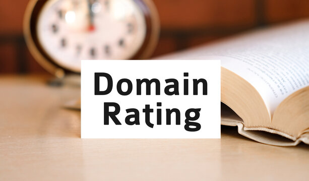 Domain Rating business concept text on a white book and clock