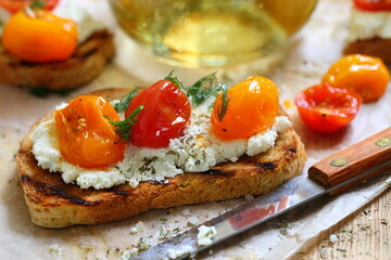 Bruschetta with ricotta cheese and sun-dried tomatoes with provencal herbs.
