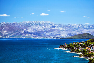 Landscape with the sea coast, mountains and city of Split in Croatia.