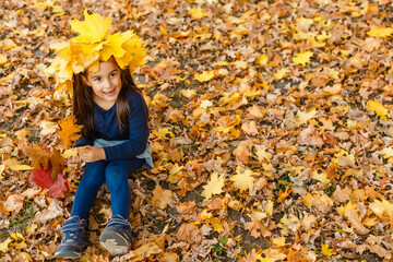 Autumn season leisure. Atmosphere of autumn. Adorable smiling schoolgirl autumn foliage background. Good mood. Happy child. Welcome october. United with nature. Little child walk in autumn park.