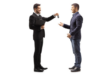 Car salesman giving car keys to a man
