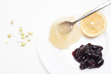 Vitamins (lemon, honey and jam) and pills