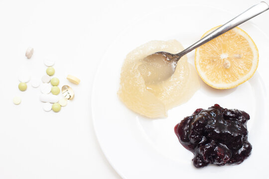 Vitamins (lemon, honey and jam) and pills
