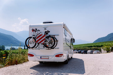 Vacation trip with RV caravan Car with bicycle on Italian South Tirol