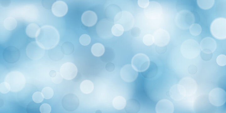 Abstract background with bokeh effects in light blue colors