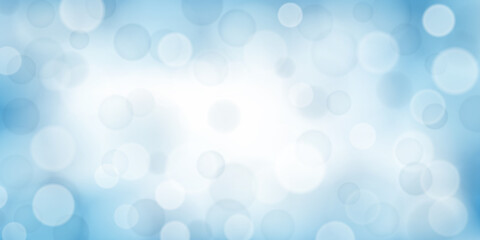 Abstract background with bokeh effects in light blue colors