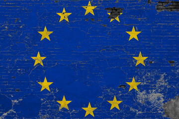 European Union flag on grunge scratched concrete surface. National vintage background. Retro wall concept.