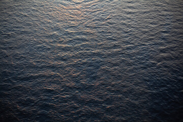 dark blue sea waves at sunset