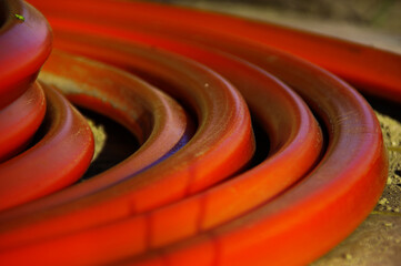 A roll of orange optical cables
