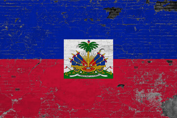 Haiti flag on grunge scratched concrete surface. National vintage background. Retro wall concept.