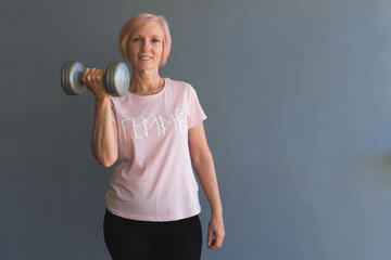 Woman exercising at home lifting weights