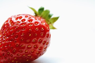 Macro  of the garden strawberry (Fragaria ananassa). Closeup of fresh red and ripe strawberry. Freshly harvested strawberry  texture. Selective focus.