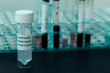 Laboratory tube with Dexamethasone inside, (covid-19 coronavirus cure), with bottom test tubes