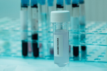 Laboratory tube with Dexamethasone inside, (covid-19 coronavirus cure), with bottom test tubes