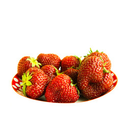 strawberries on a plate on a light background. place for text