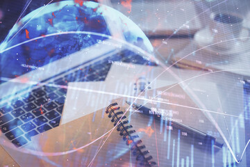 Double exposure of financial chart drawing and desktop with coffee and items on table background. Concept of forex market trading