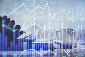 Double exposure of financial chart drawing and desktop with coffee and items on table background. Concept of forex market trading