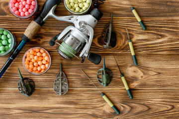 Accessories for carp fishing and fishing baits on wooden planks with copy space