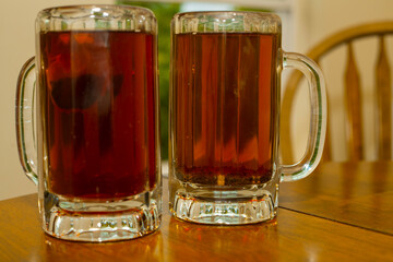 tea lovers' dream: black tea in glass bear mugs (isolated) 