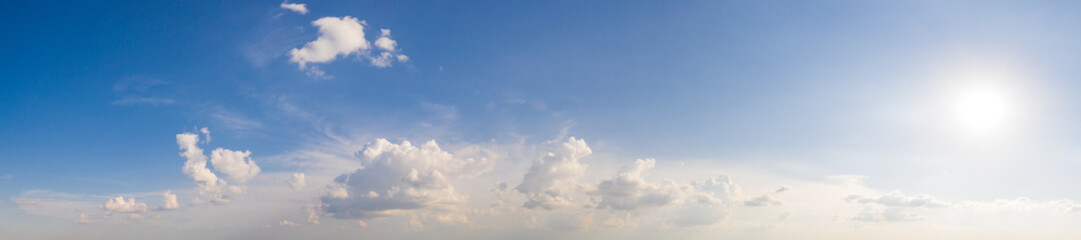 Fototapeta na wymiar Wide sky panorama with scattered cumulus clouds
