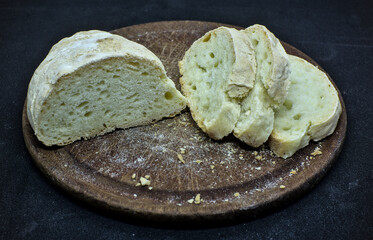 Sliced bread on a wooden board