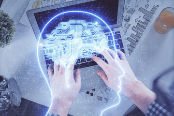 Plakat Double exposure of man's hands typing over computer keyboard and brain hologram drawing. Top view. Ai and data technology concept.