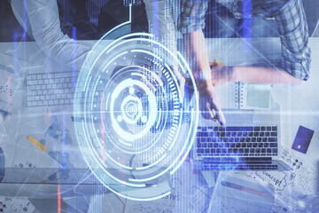 Double exposure of man and woman working together and data theme hologram drawing. Computer background. Top View.
