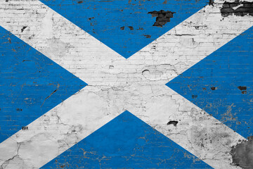 Scotland flag on grunge scratched concrete surface. National vintage background. Retro wall concept.