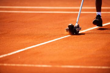 silhouette shadow  of a tennis player on a clay court