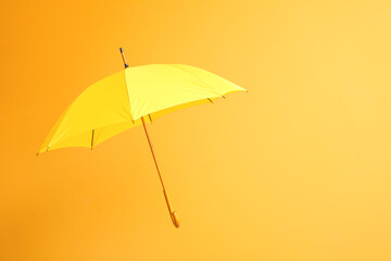 Fototapeta na wymiar Stylish umbrella on color background