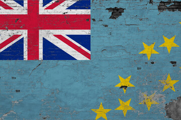Tuvalu flag on grunge scratched concrete surface. National vintage background. Retro wall concept.
