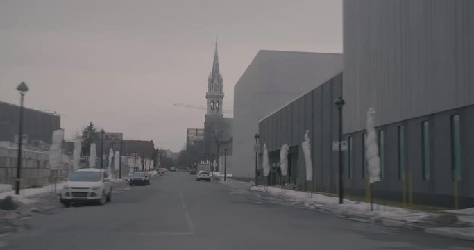 Montreal, QC, Canada - November 15 , 2017: Driving on Viger Avenue Est while passing by Alexandre DeSeve Street corner, with cloudy sky during winter.