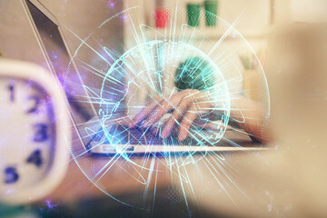 Double exposure of woman hands typing on computer and business theme hologram drawing. Success concept.