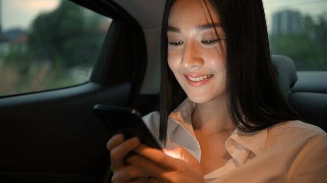 Travel concept. Asian women sitting on mobile phones in cars. 4k Resolution.