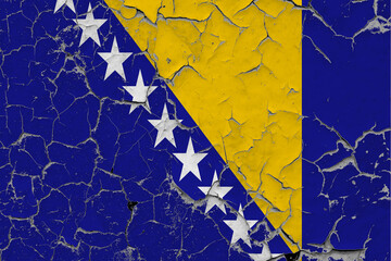 Bosnia Herzegovina flag close up grungy, damaged and scratched on wall peeling off paint to see inside surface. Vintage National Concept.
