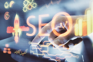 Multi exposure of man's hands holding and using a digital device and seo drawing. search...