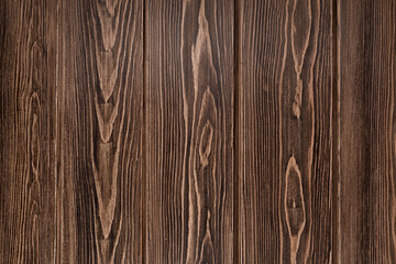 Natural background from larch boards. Textured wood surface. Dark brown color