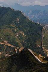 Panorama of Great wall of China surrounded by beautiful wild forest landscape 