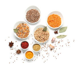 Plates with lentils and spices on white background