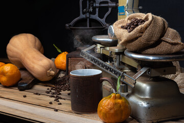 oranges, bananas, a pumpkin and old accessories on wood