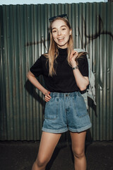 beautiful stylish blonde girl walks after party flash architecture