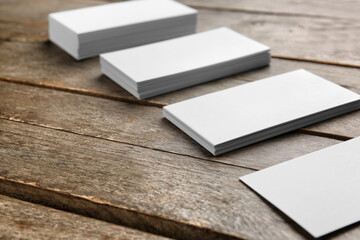 Blank business cards on wooden background