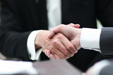 close up. business partners, confirming their agreement with a handshake.