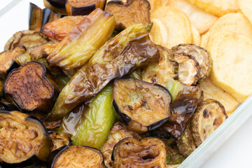 Turkish Food Fried, Aubergine or Eggplant Slices and potatoes on the glass plate.