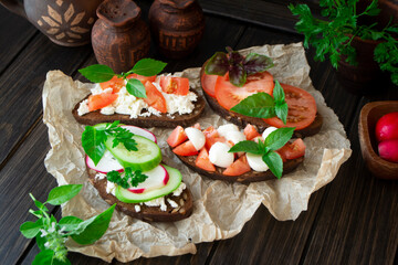 Assorted bruschetta with various toppings. Appetizing bruschetta or sandwiches. Mix bruschetta
