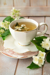 Jasmine herbal tea on a shabby wooden table