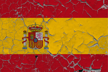 Spain flag close up grungy, damaged and scratched on wall peeling off paint to see inside surface. Vintage National Concept.