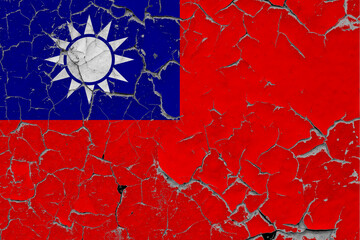Taiwan flag close up grungy, damaged and scratched on wall peeling off paint to see inside surface. Vintage National Concept.