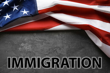Fototapeta na wymiar American flag and word IMMIGRATION on grey background, top view