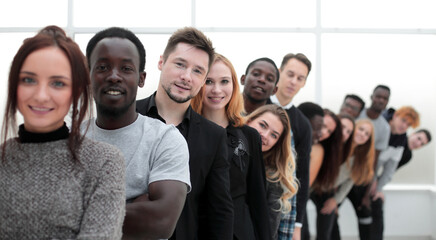close-up . young woman standing in front of a group of young people